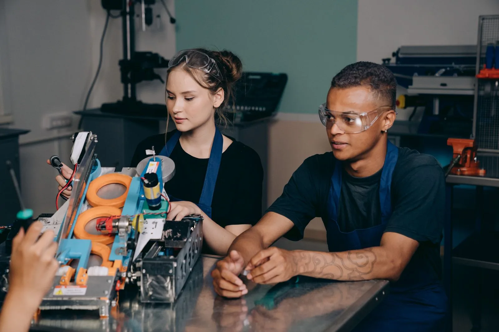A man and woman working together inside a factory