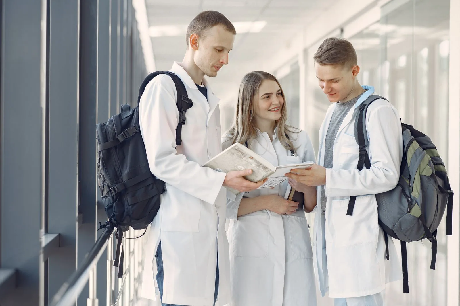 A group of medical students training together in a hospital hallway