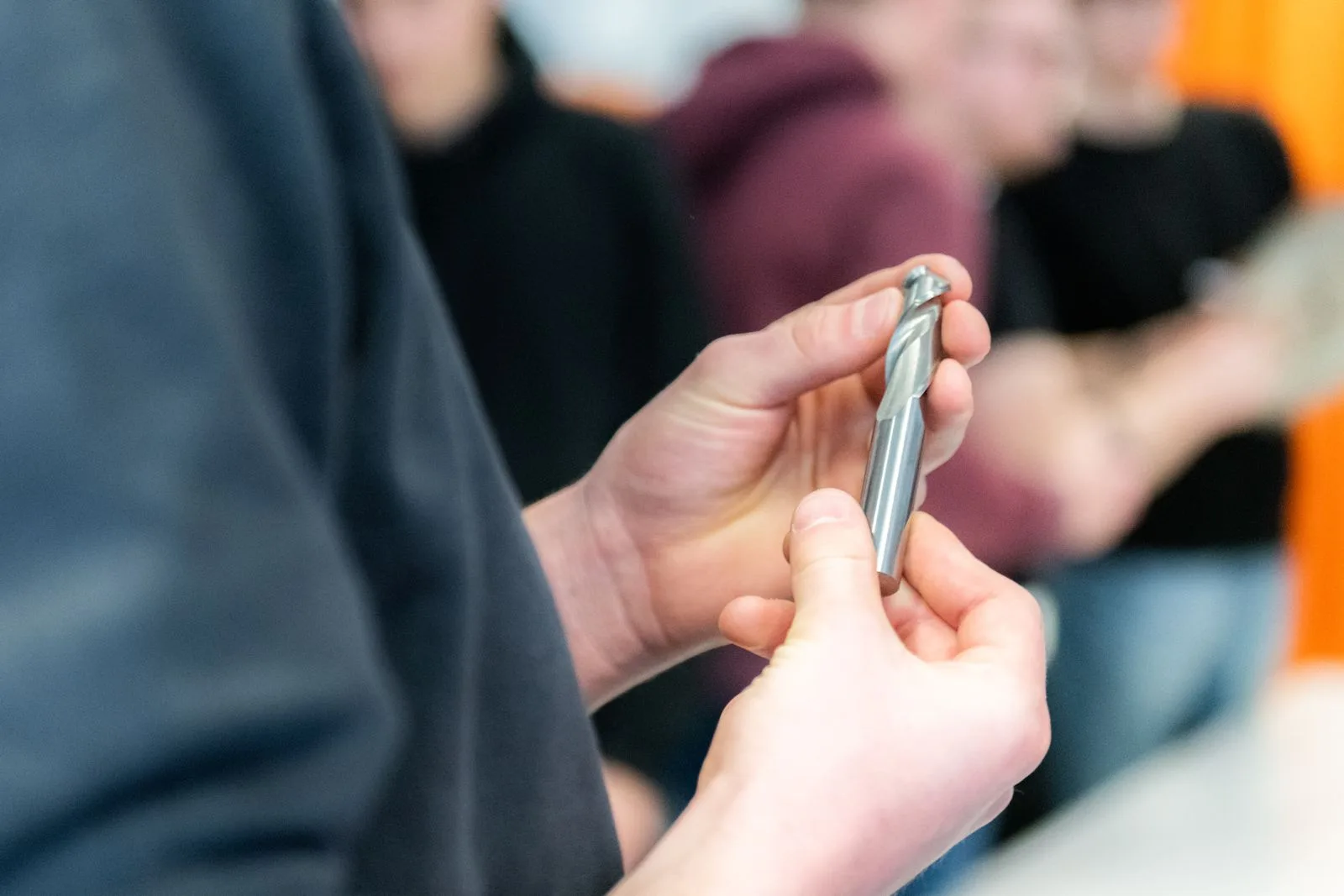 Close-up of precision tool handling during a workshop session